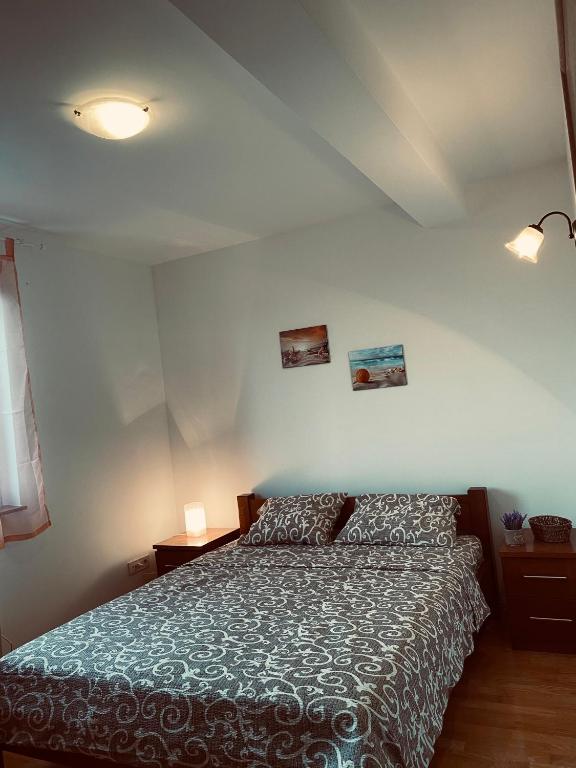 Postel nebo postele na pokoji v ubytování Apartmani Vila Goč