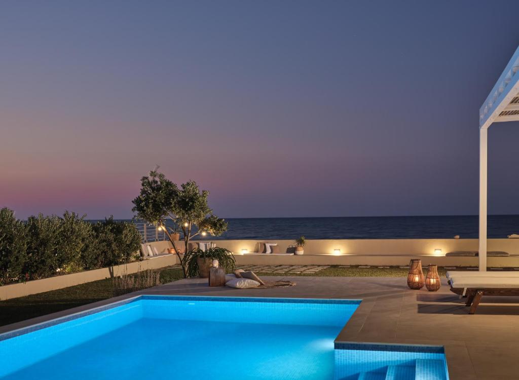 The swimming pool at or close to Astarte Villas - Onda Del Mar Beach Villa