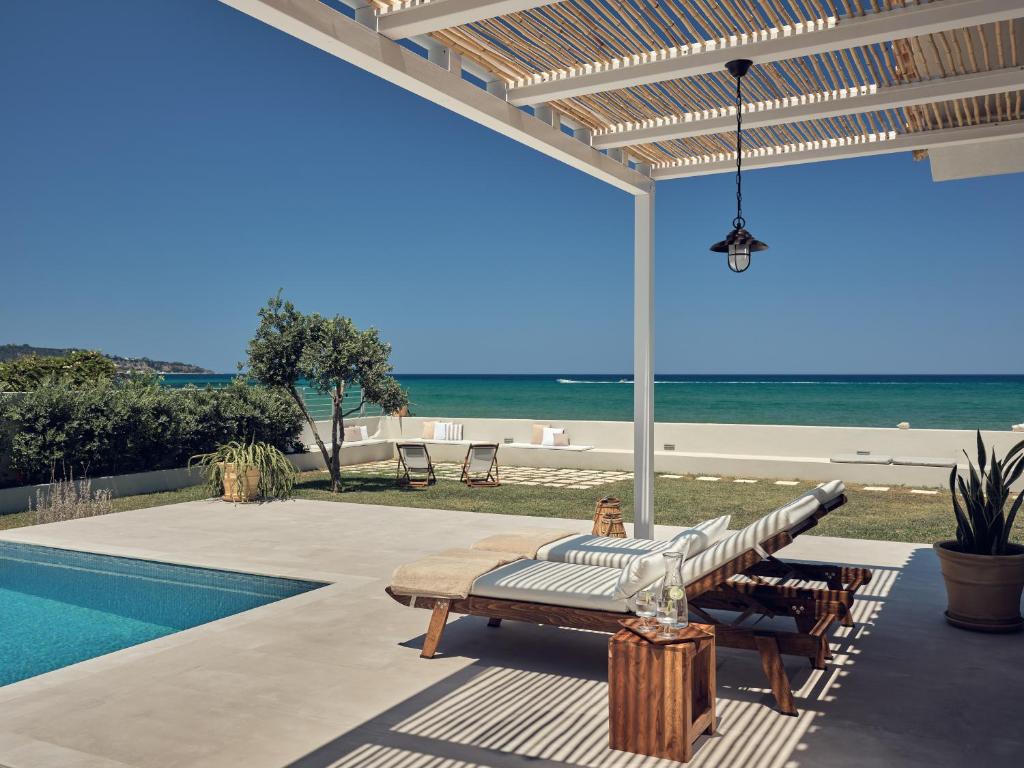 The swimming pool at or close to Astarte Villas - Onda Del Mar Beach Villa