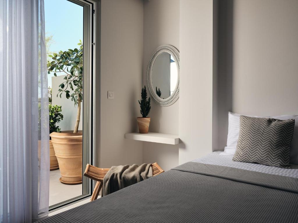 A bed or beds in a room at Astarte Villas - Onda Del Mar Beach Villa