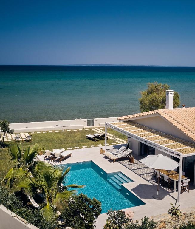 The swimming pool at or close to Astarte Villas - Onda Del Mar Beach Villa