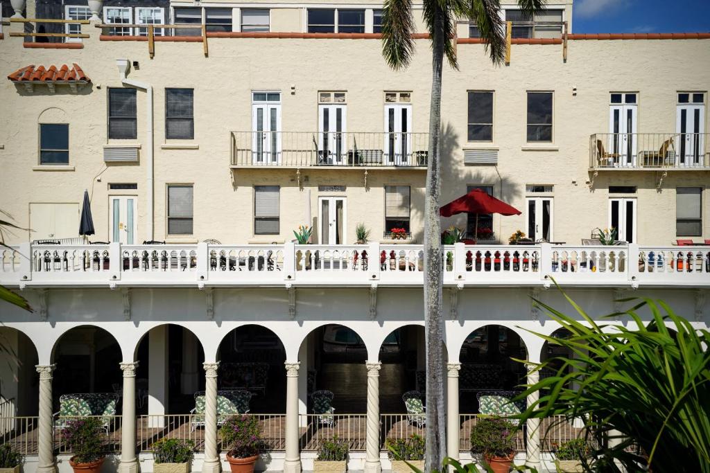 a large white building with a white balcony at Palm Beach Historic Hotel with Juliette Balconies! Valet parking included! in Palm Beach