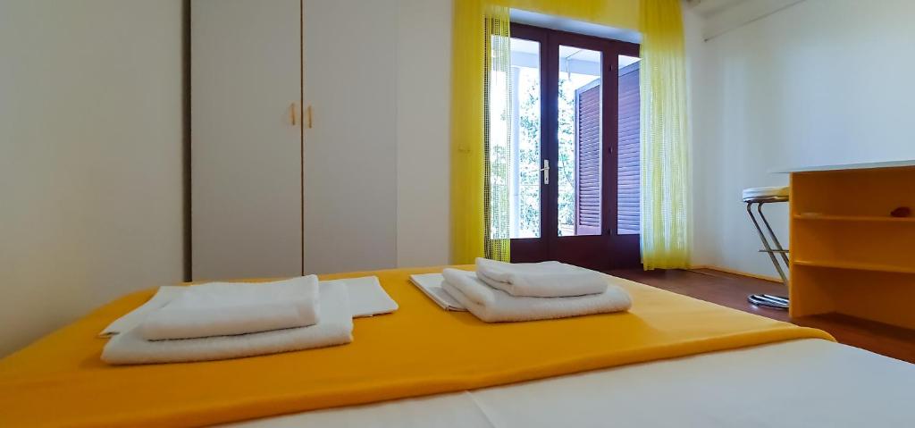 Łóżko lub łóżka w pokoju w obiekcie Apartment Buco