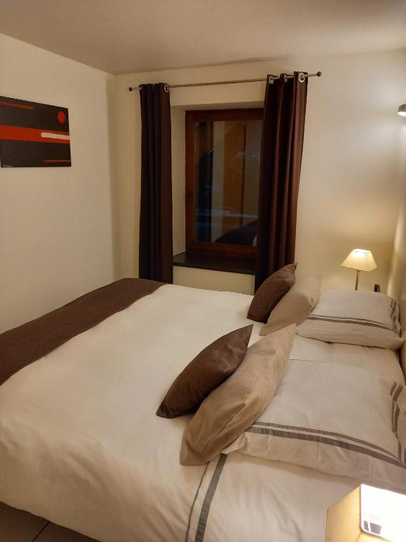 Postel nebo postele na pokoji v ubytování Hebergement confort Comfortlogies La Fontanella