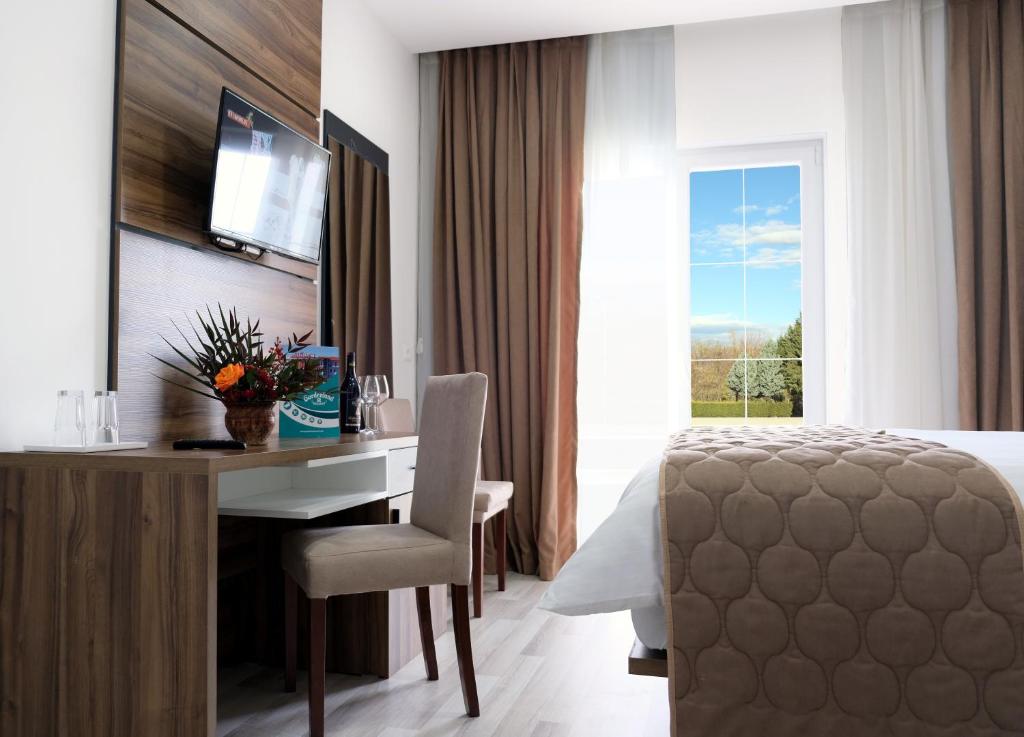 TV a/nebo společenská místnost v ubytování Gardenland Resort