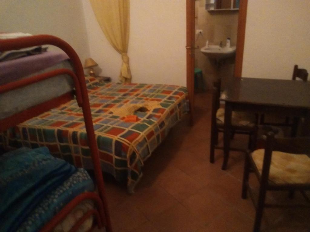 A bed or beds in a room at Room in Guest room - Room with Etna view