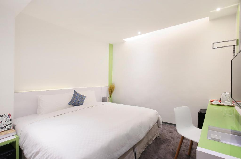 Postel nebo postele na pokoji v ubytování CityInn Hotel Plus - Taichung Station Branch