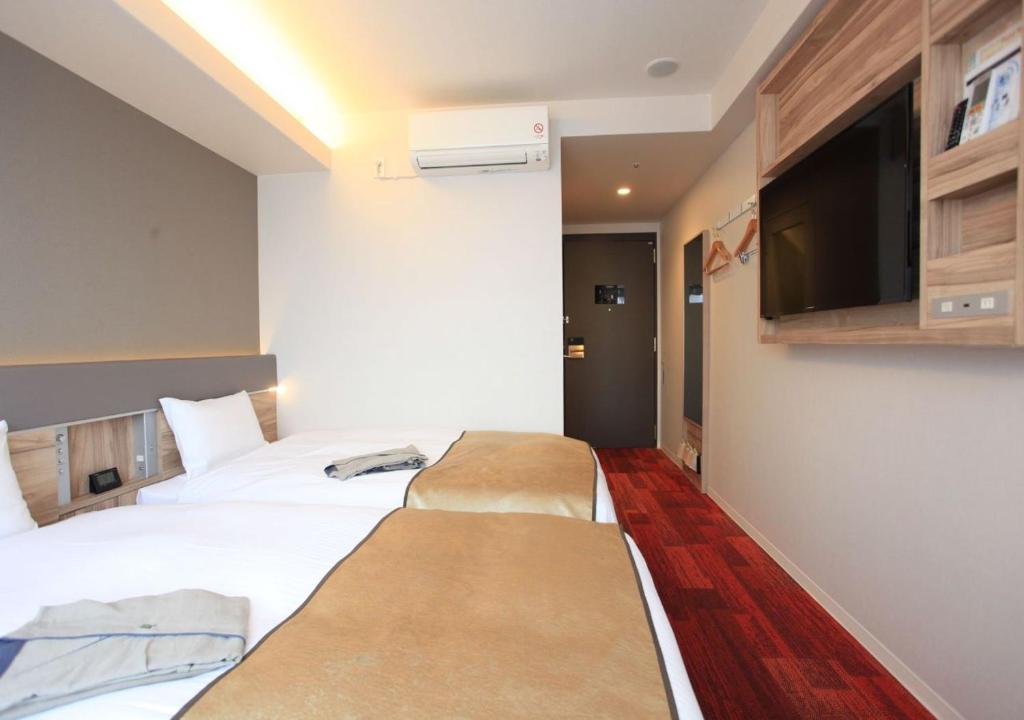 TV a/nebo společenská místnost v ubytování Urban Hotel Kyoto Gojo Premium