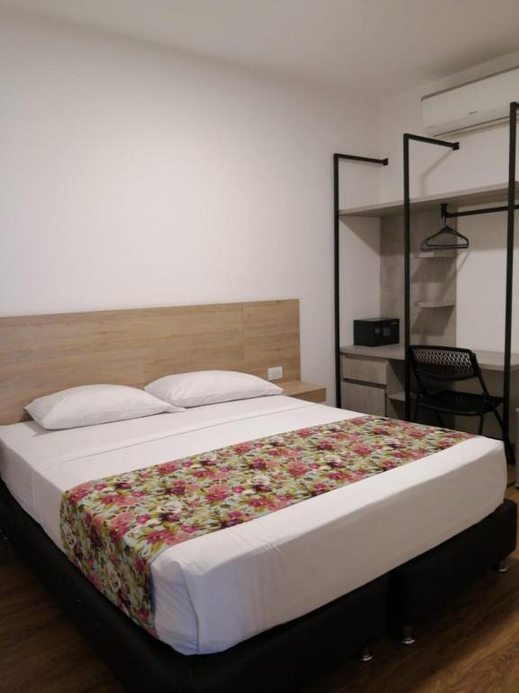 Postel nebo postele na pokoji v ubytování Hotel Poma Rosa