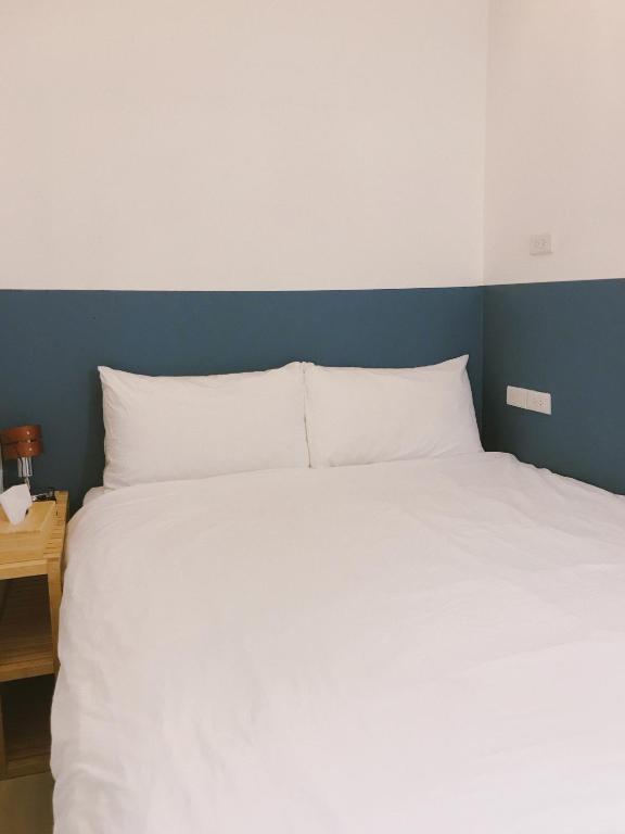 Postel nebo postele na pokoji v ubytování PlainStay Hostel