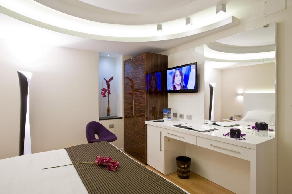 Televízia a/alebo spoločenská miestnosť v ubytovaní Hotel Coppe Trieste - Boutique Hotel
