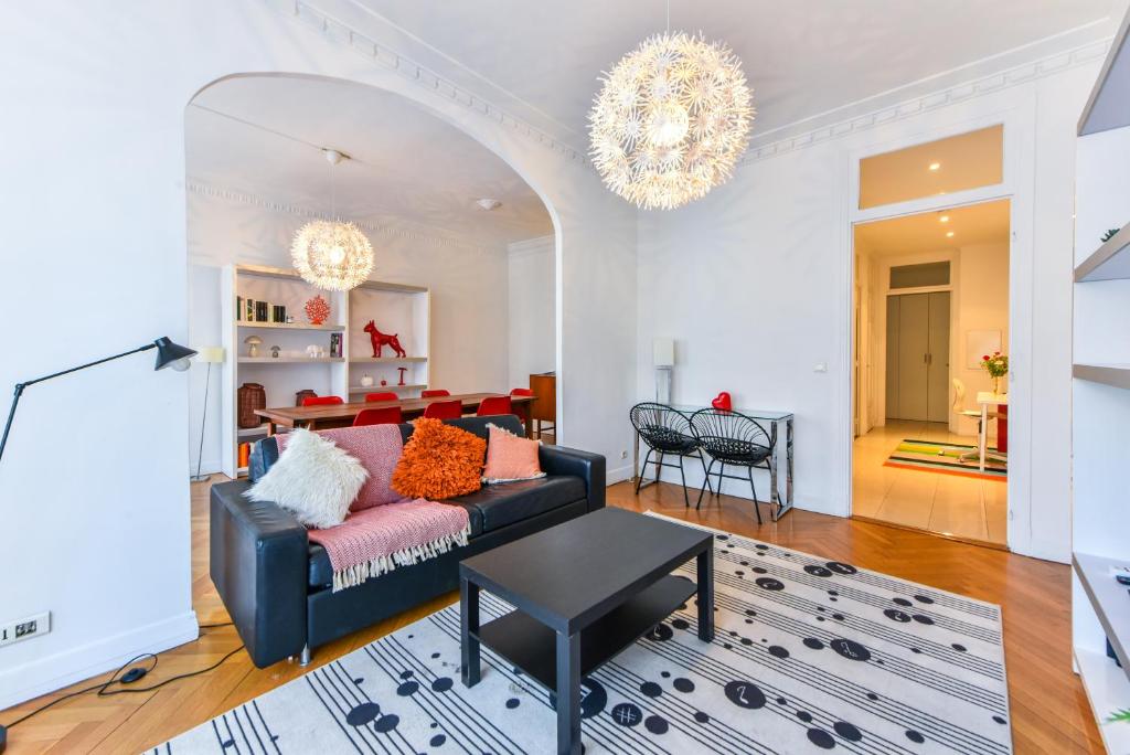 a living room with a couch and a table at Le Maréchal in Nice