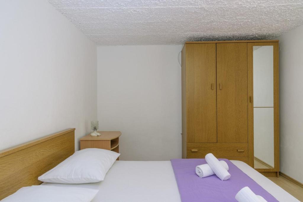 Postel nebo postele na pokoji v ubytování Apartments Meri