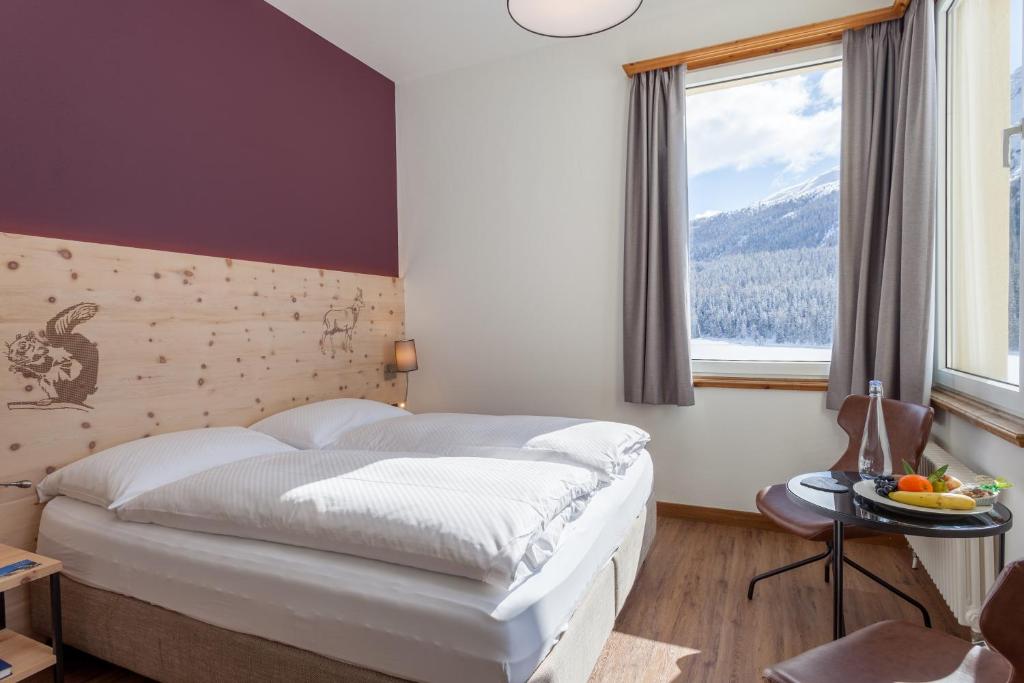 Postel nebo postele na pokoji v ubytování Hotel Waldhaus am See
