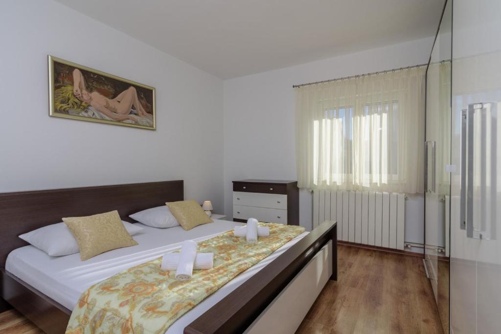 Postel nebo postele na pokoji v ubytování Apartments Meri