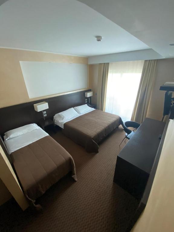 Voodi või voodid majutusasutuse E' Hotel toas