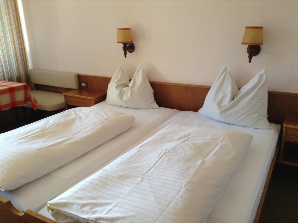 Postel nebo postele na pokoji v ubytování Hotel Tannerhof