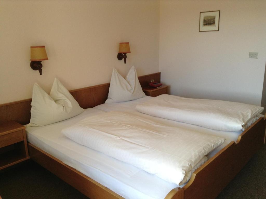 Postel nebo postele na pokoji v ubytování Hotel Tannerhof