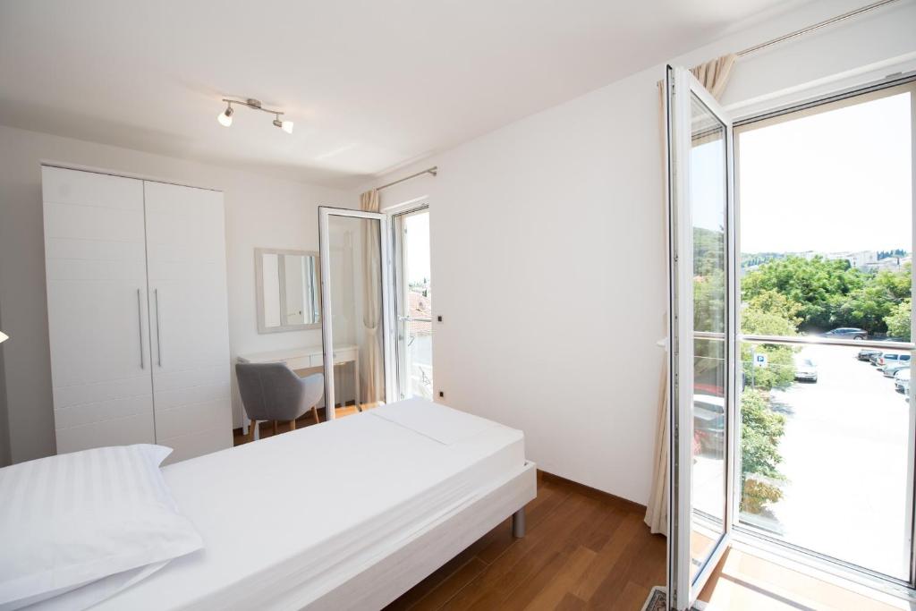 Posteľ alebo postele v izbe v ubytovaní Apartment Maro Bayview