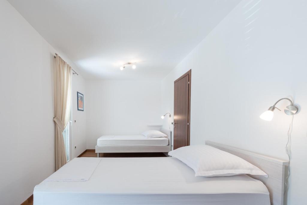 Posteľ alebo postele v izbe v ubytovaní Apartment Maro Bayview