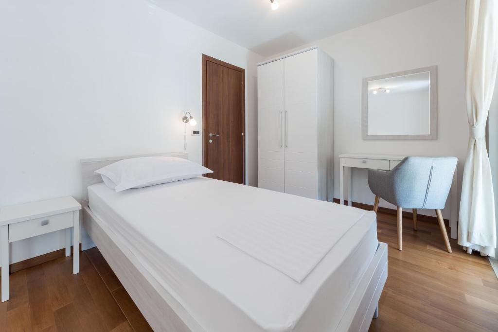 Posteľ alebo postele v izbe v ubytovaní Apartment Maro Bayview