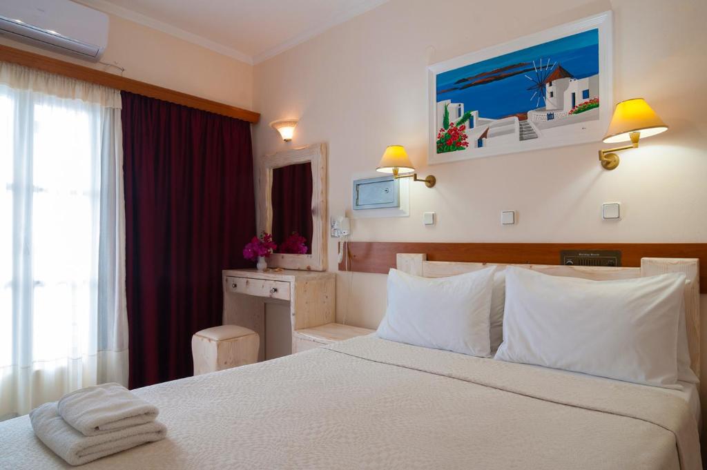 Ein Bett oder Betten in einem Zimmer der Unterkunft Holiday Beach Resort