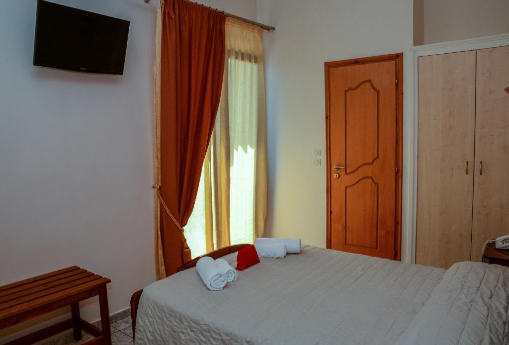 Postel nebo postele na pokoji v ubytování Poseidonio Hotel
