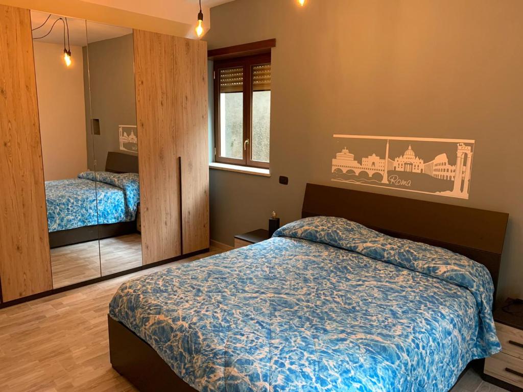 A bed or beds in a room at La Dimora dei Consoli - Holiday House Roma Vatican