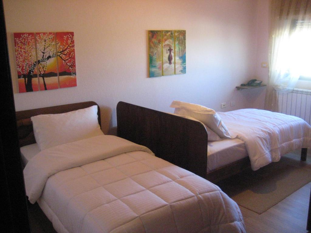 Postel nebo postele na pokoji v ubytování Drini Hotel