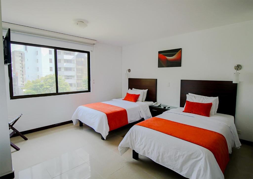 Postel nebo postele na pokoji v ubytování Hotel Pinares Plaza
