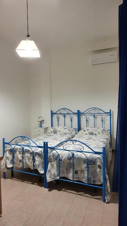 A bed or beds in a room at La casa dei venti