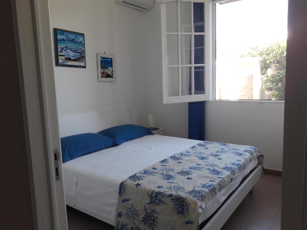 A bed or beds in a room at La casa dei venti