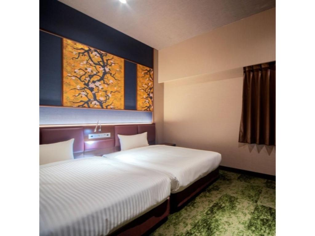 Katil atau katil-katil dalam bilik di Hotel Halrotto Fukuoka Hakata - Vacation STAY 18610v