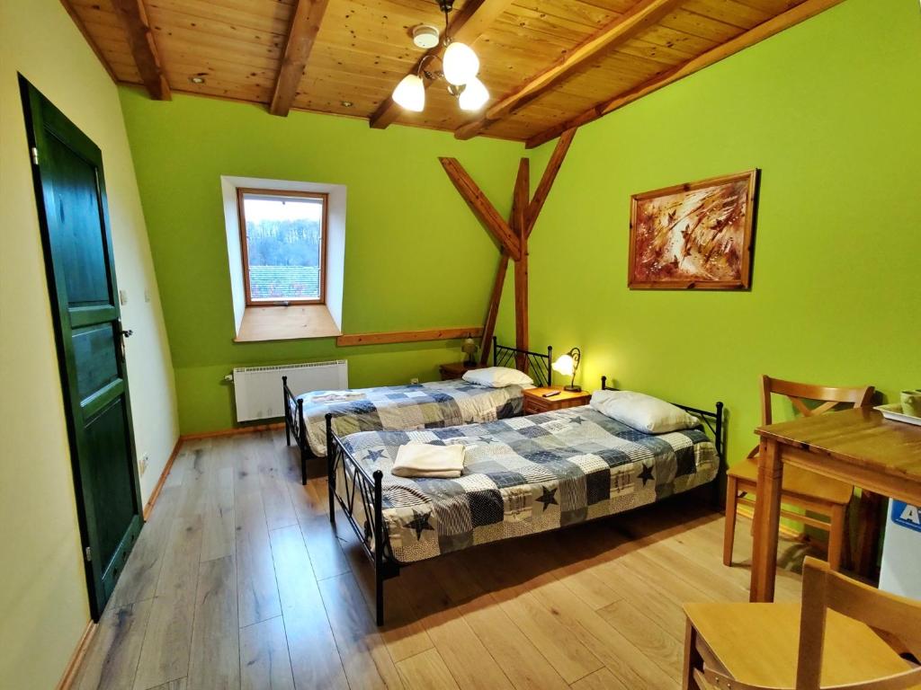 Postel nebo postele na pokoji v ubytování Młyn Wielisław Agroturystyka i Restauracja
