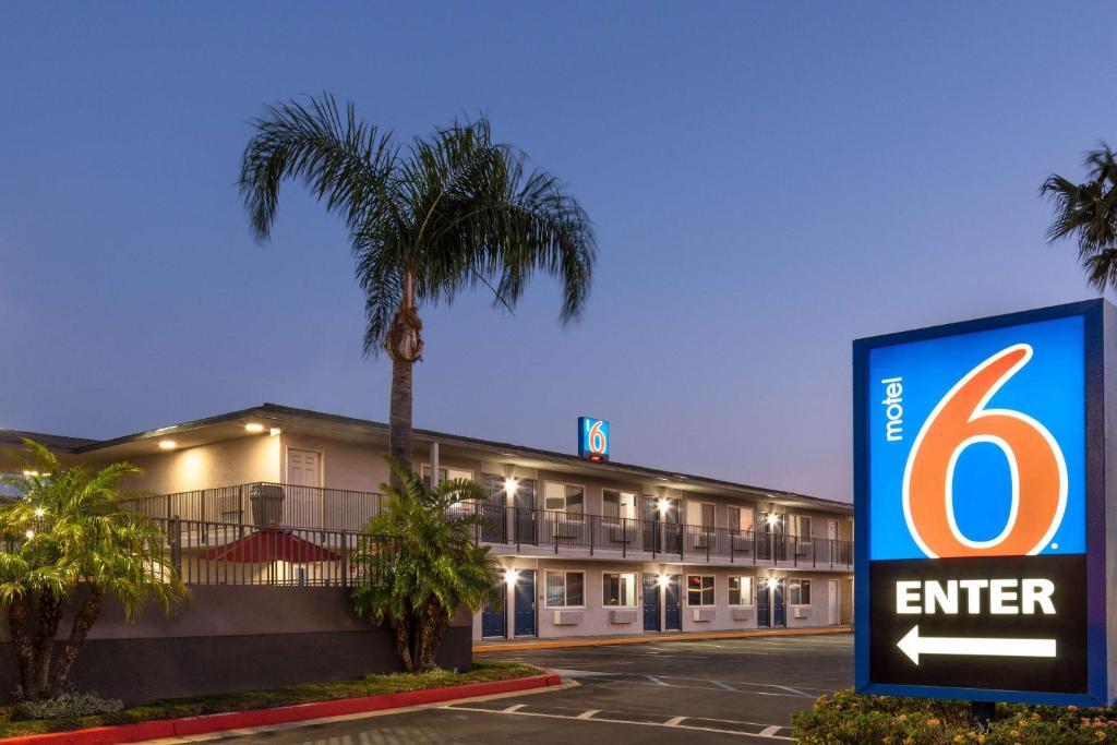 a hotel with a sign in front of a building at Motel 6-Fontana, CA in Fontana