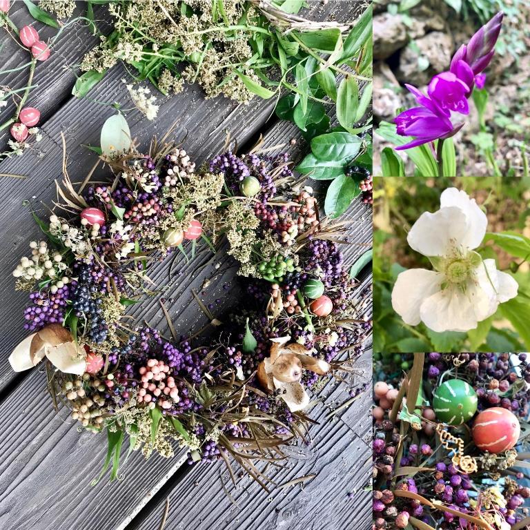 a wreath of flowers and plants on a wooden table at Travelers House おーさんてぃん青空舎 in Taketomi
