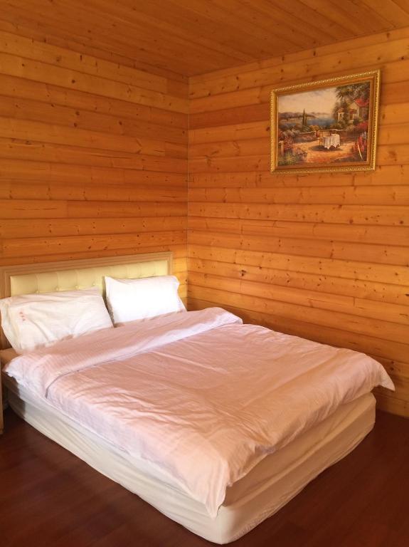 Postel nebo postele na pokoji v ubytování Yun Hsiang Zhan Chalet