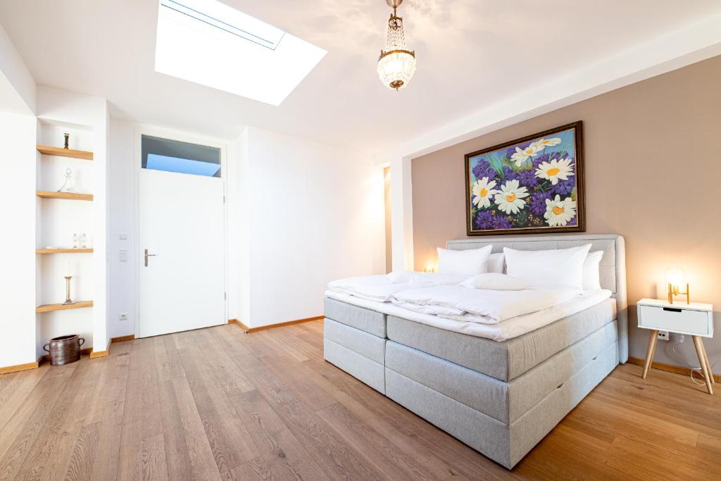 Postel nebo postele na pokoji v ubytování Alpen Loft