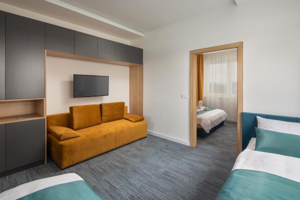 Posteľ alebo postele v izbe v ubytovaní Sziget Hotel