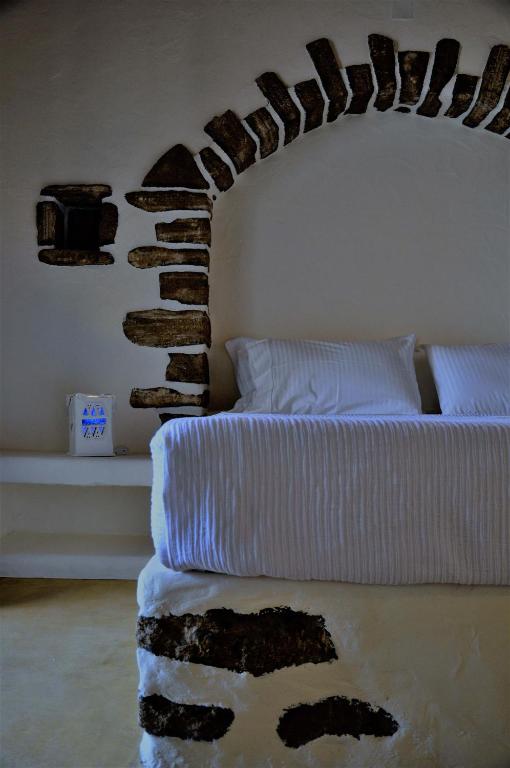 Postel nebo postele na pokoji v ubytování Pambelos Lodge