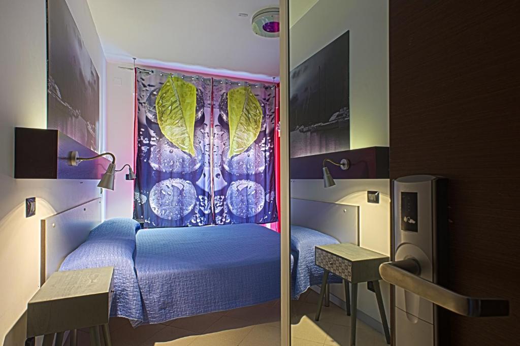 Postel nebo postele na pokoji v ubytování Bella Pescara B&B