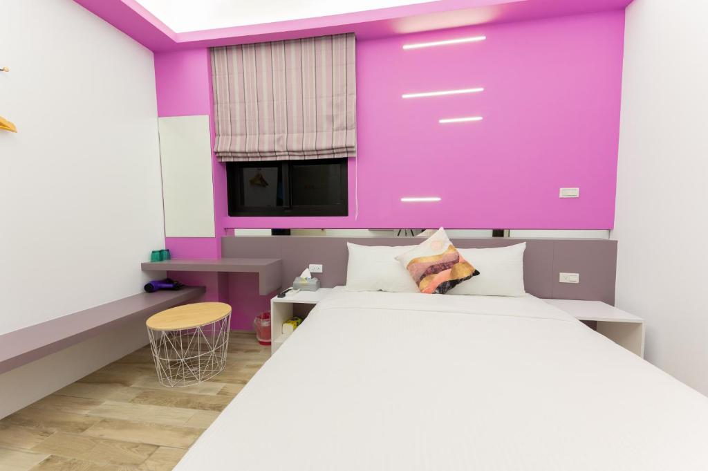 Postel nebo postele na pokoji v ubytování Haipai Sweetheart Homestay