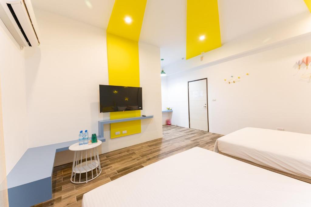 Postel nebo postele na pokoji v ubytování Haipai Sweetheart Homestay