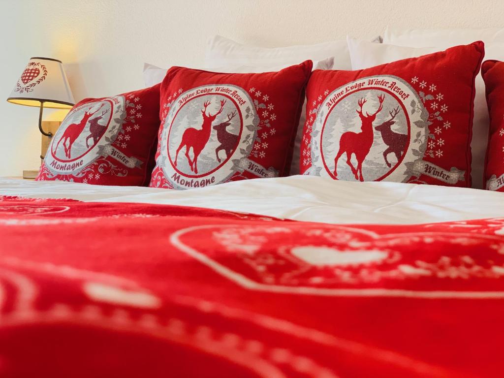 Letto o letti in una camera di Hôtel de charme la Poste