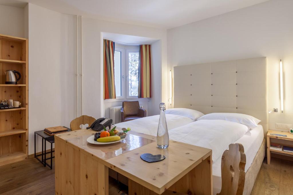 Postel nebo postele na pokoji v ubytování Hotel Waldhaus am See