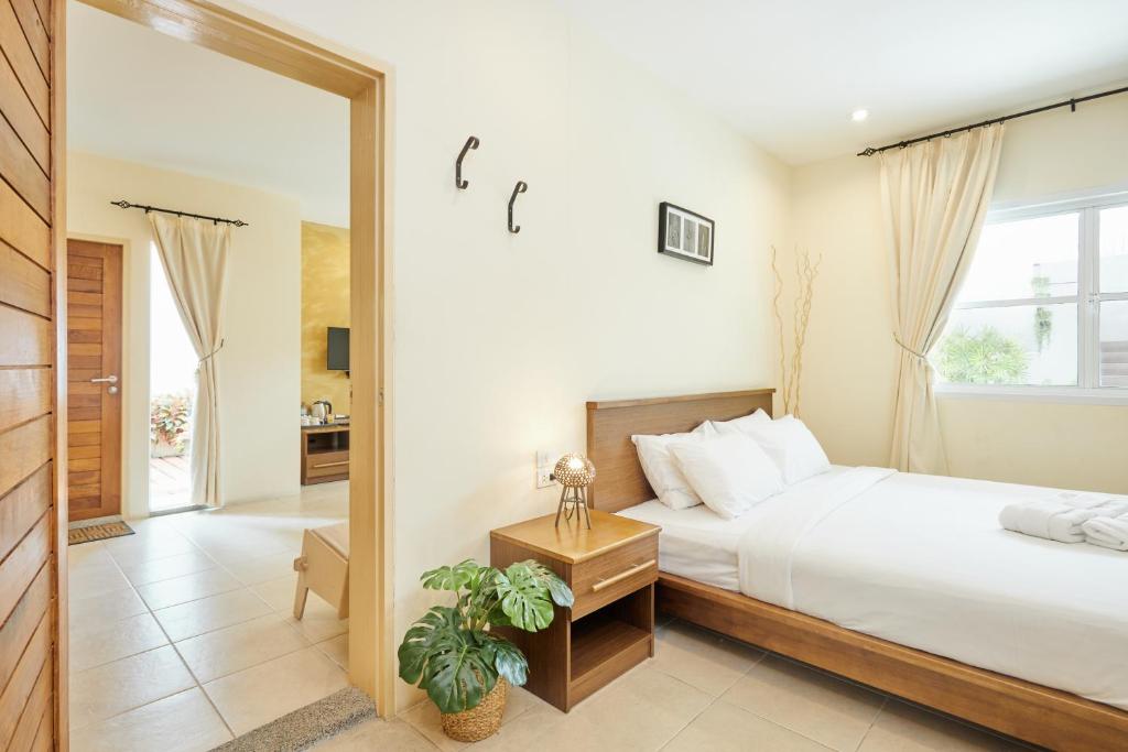 Postel nebo postele na pokoji v ubytování Talay Hotel and Villa Cha-am
