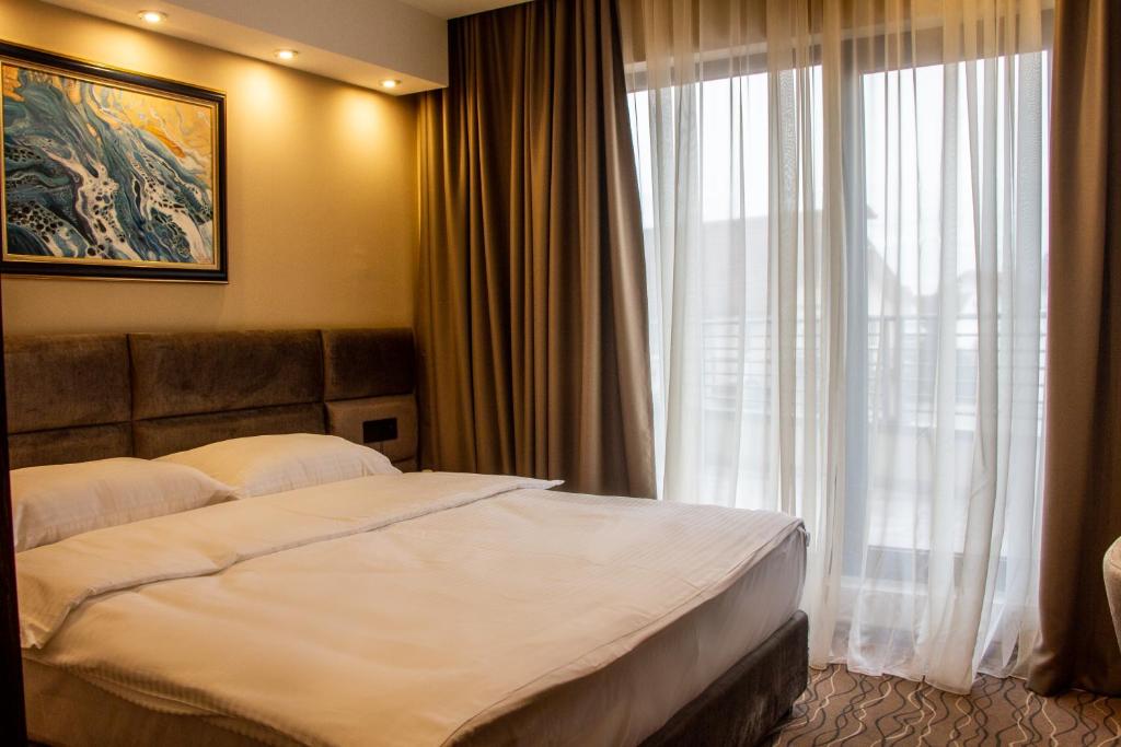 Postel nebo postele na pokoji v ubytování NEW Garni Hotel FILIA