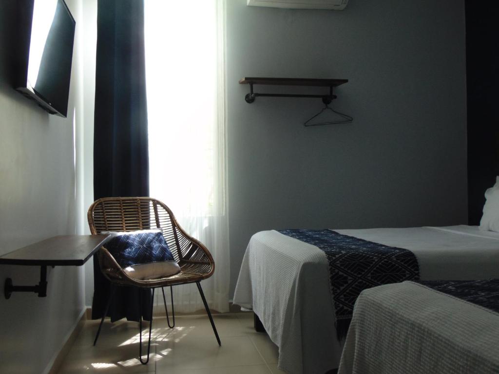 Postel nebo postele na pokoji v ubytování Hotel Puerta Del Sol