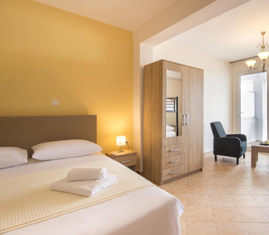 A bed or beds in a room at Rooms Kavala