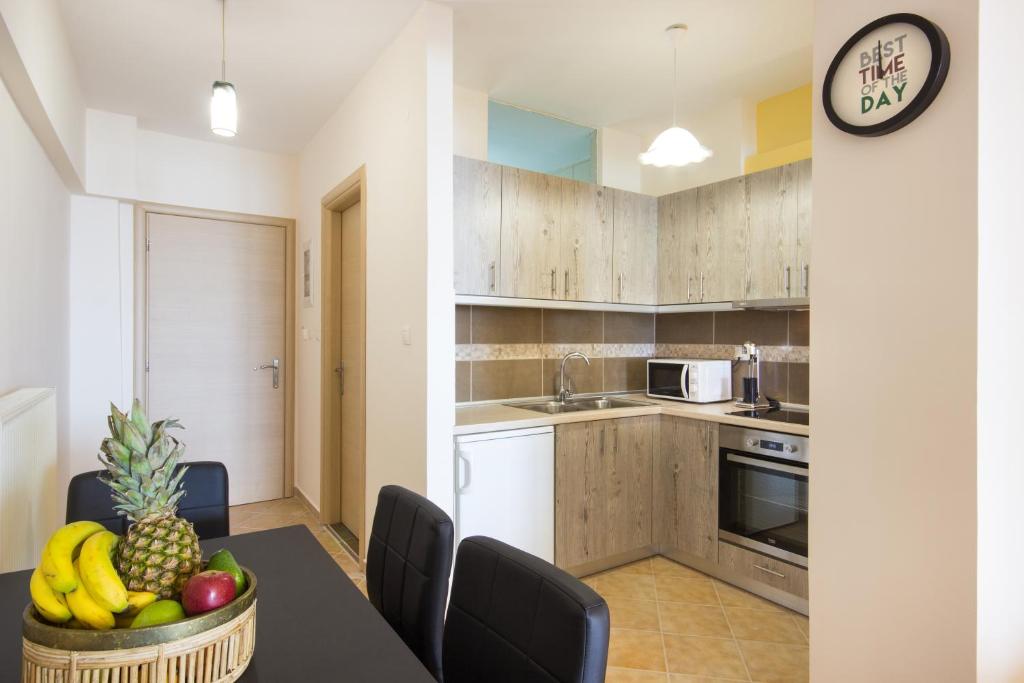 A kitchen or kitchenette at Rooms Kavala